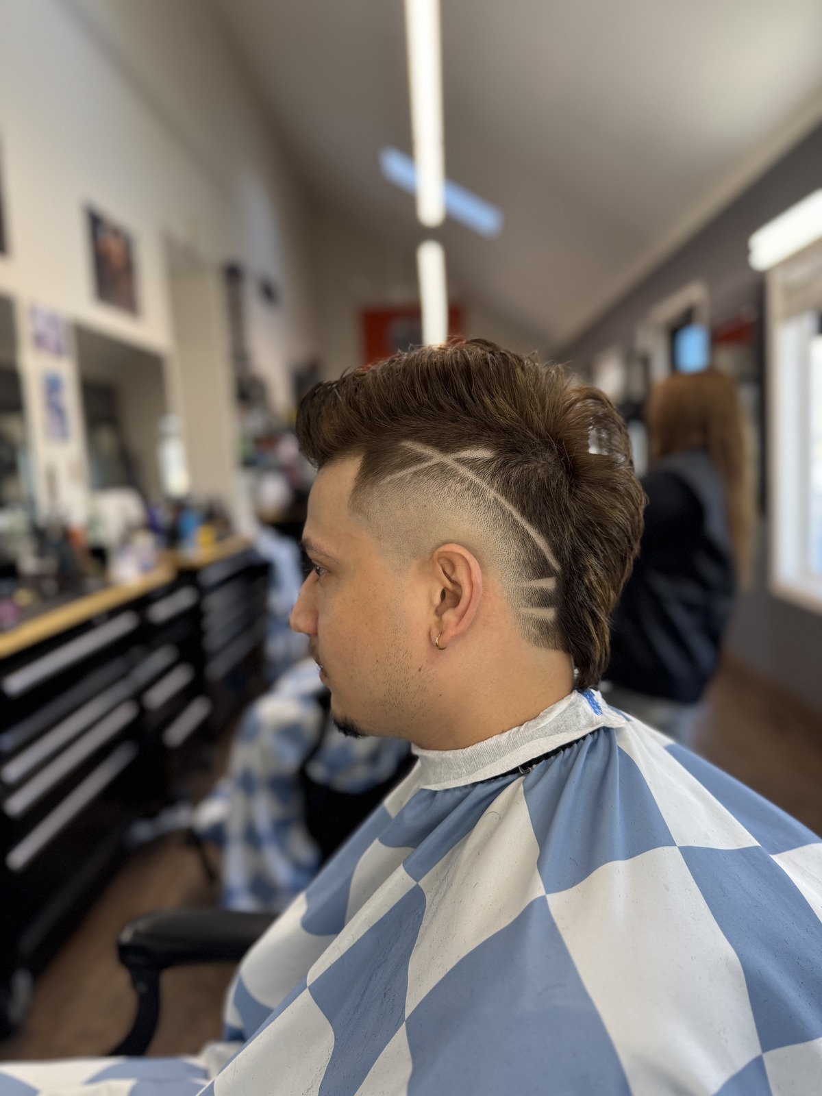 Design cut with fade at Dawson Creek Barbershop