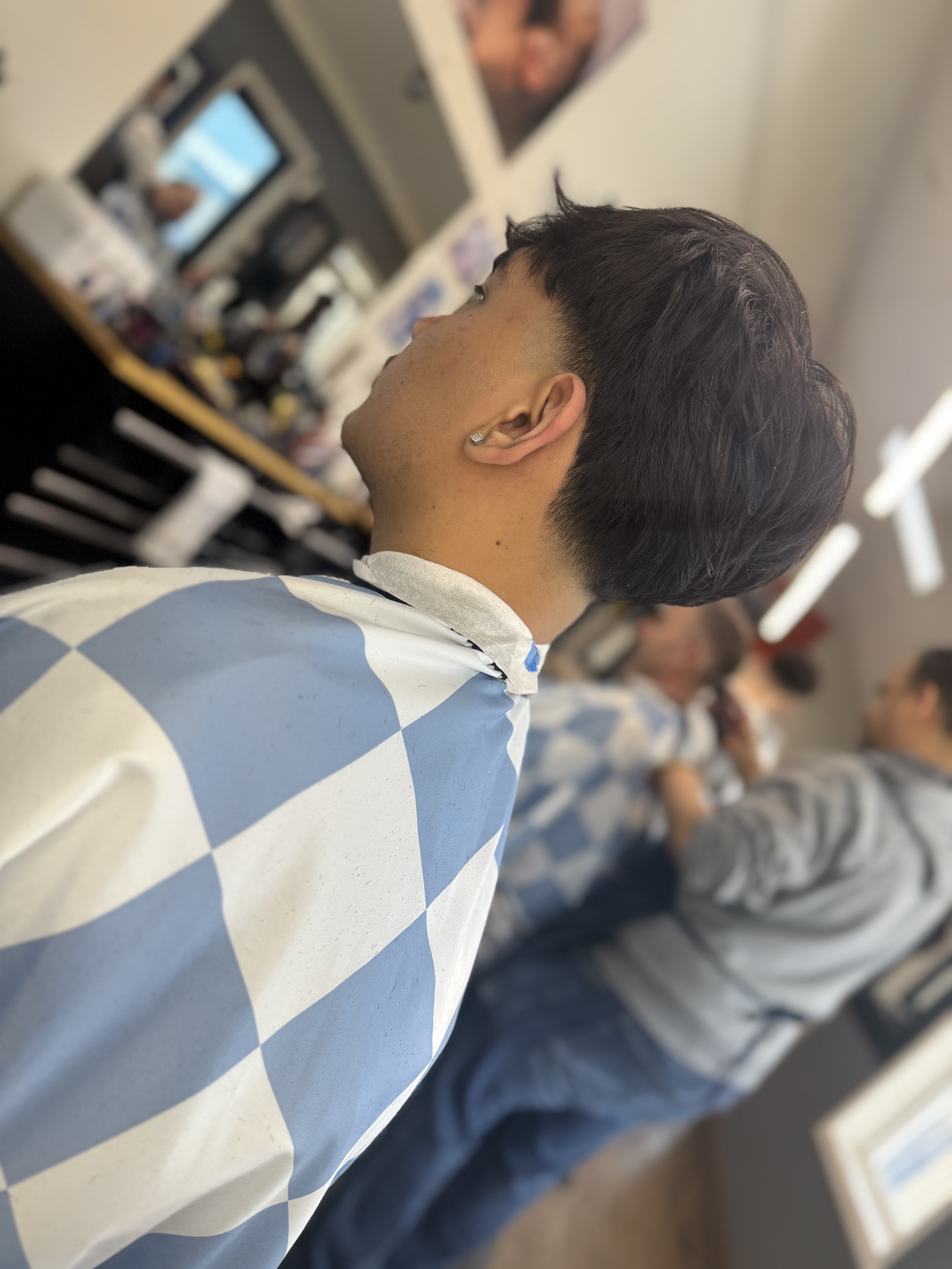 Taper fade — side view at Dawson Creek Barbershop